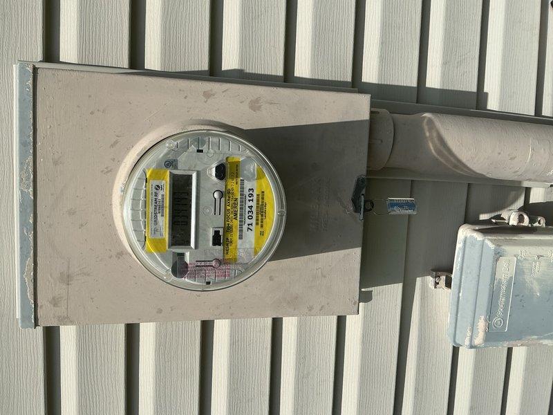 Responded to service call for newly installed water heater with no power. Inspected electrical service entrance at exterior meter base and traced wiring through conduit system to interior junction box. Examined connections at junction box where flex conduit supplies power circuit to water heater location. Verified proper wire terminations at terminal blocks and assessed circuit integrity from main panel through distribution point. Documented electrical infrastructure including meter socket, service disconnect, and branch circuit wiring configuration to determine cause of power failure to new water heater installation.