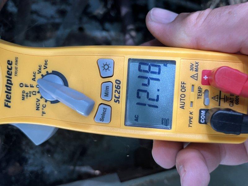 Responded to no cooling call on AC system. Upon arrival, found condensing unit failing to energize on call for cooling. Performed diagnostic testing and identified faulty contactor preventing unit operation. Verified voltage readings at contactor terminals showing 13.15V, confirming low voltage control circuit functioning but contactor not pulling in. Inspected Goodman condensing unit model R4K4-037JAZ and determined single pole contactor had failed. Replaced defective contactor with proper replacement part, restored power, and cycled system through multiple cooling cycles to verify proper operation. Condensing unit now engaging properly on thermostat call. System operating within normal parameters.