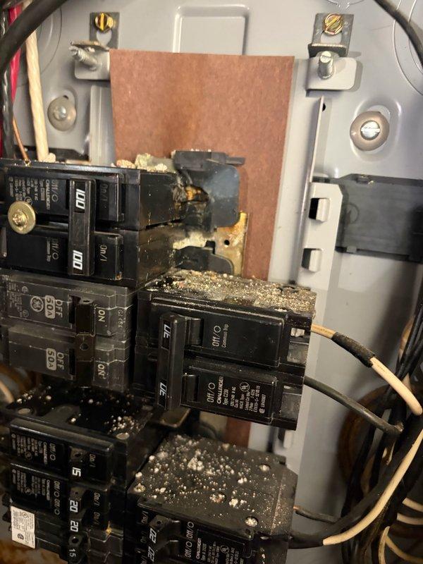 Responded to follow-up service call for no cooling issue related to electrical panel. Upon inspection, discovered severely damaged circuit breaker with extensive charring, melting, and burn marks indicating electrical arcing or overheating event. Replaced damaged breaker, cleaned debris and residue from surrounding components, verified all connections were secure, and confirmed proper panel operation. System restored to safe working condition.