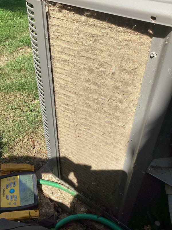 Responded to no cooling complaint on residential outdoor HVAC unit. Upon arrival, found system blowing warm air as reported. Performed diagnostic inspection and discovered severely clogged air filter with heavy accumulation of dirt, dust, and debris restricting airflow. Removed contaminated filter from unit housing and replaced with new filter. Verified proper airflow restoration and system operation. Unit returned to normal cooling function. Advised customer on recommended filter maintenance schedule to prevent future airflow restrictions.