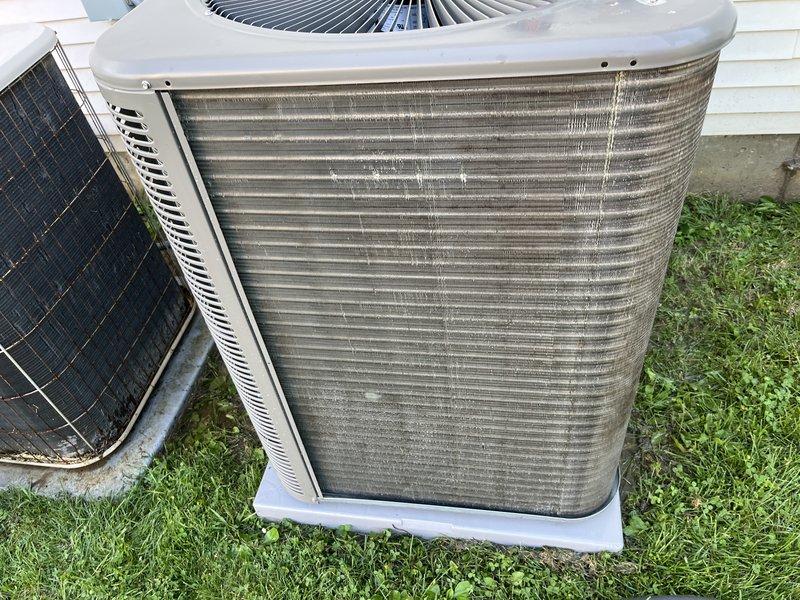 Responded to cooling efficiency concern on 26-year-old Lennox system. Performed comprehensive inspection revealing heavily soiled condenser coil with significant dirt accumulation and streaking on exterior louvers, restricting airflow and reducing heat transfer capacity. Thoroughly cleaned condenser coil and fins, removed debris buildup, and verified proper refrigerant charge on R-22 system. Checked electrical connections, tested capacitor values within acceptable range, and confirmed fan motor operation. Measured temperature split and airflow, which improved significantly after coil cleaning. Inspected indoor evaporator coil access and filter condition. Verified system cycling properly with improved cooling performance. Recommended monitoring system performance and discussed age-related considerations for 26-year-old equipment. System restored to optimal operating condition given equipment age.