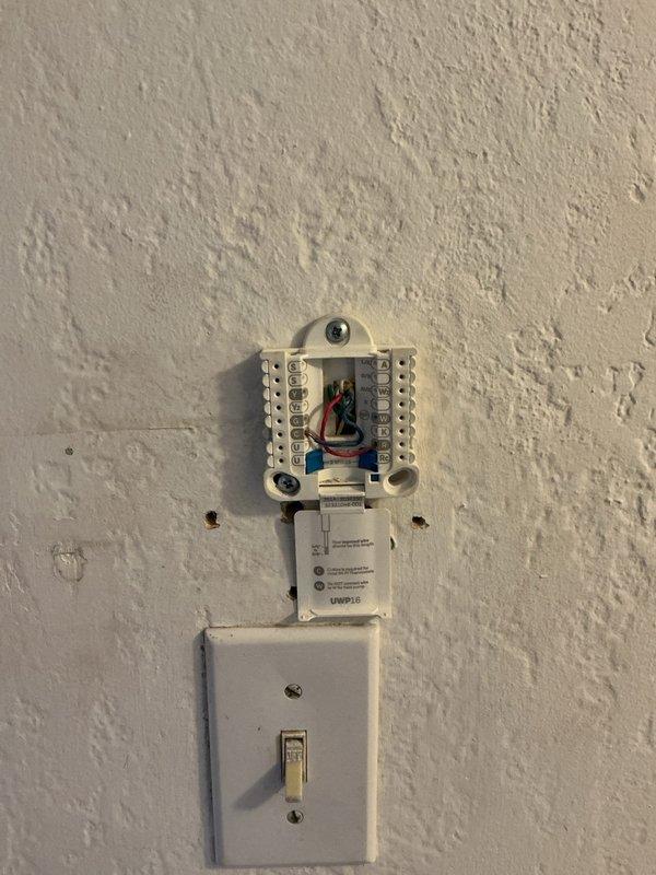 Responded to no cooling complaint on less than one-year-old Unico system installed by another contractor. Found thermostat wiring issues at wall terminal block with improper connections affecting system operation. Corrected thermostat wiring connections and reinstalled Honeywell Home ProSeries thermostat. Advised customer to keep system off until repairs were completed. Verified proper system operation and cooling performance after corrections were made.