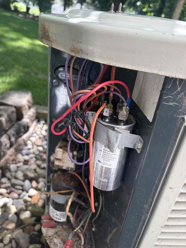 Responded to no-cooling callback on outdoor condensing unit. Upon arrival, inspected electrical components and found failed dual-run capacitor preventing compressor and condenser fan operation. Replaced defective capacitor with proper rated replacement, verified all wire connections secure, and tested system operation. Unit now cooling properly with normal amperage draw on both compressor and fan motor.