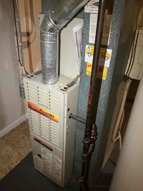# HVAC Service Report - No Cool Air Complaint

Responded to service call for air conditioning system not producing cold air throughout residence. Upon arrival, performed comprehensive system diagnostic to identify root cause of cooling failure.

Conducted visual inspection of indoor furnace unit and associated HVAC components in basement mechanical room. Examined Plus 80 furnace with connected ductwork, humidifier system, and related plumbing connections. Verified proper electrical connections and assessed overall system configuration.

Proceeded to outdoor condensing unit to evaluate compressor operation, refrigerant levels, and electrical components. Checked capacitor functionality, contactor operation, and verified proper voltage supply to unit. Measured temperature differential across evaporator coil to determine cooling performance.

Identified issue preventing proper cooling operation and performed necessary repairs to restore system functionality. Tested system operation through