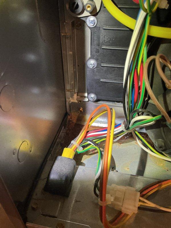# HVAC Service Completed

Responded to Home Depot lead for residential air conditioning system experiencing surging and unusual noise following a power outage. Upon arrival, performed diagnostic inspection of the unit's electrical and control systems. Accessed the main control compartment and thoroughly examined the control boards, which displayed active power with LED readout showing 95.3. Inspected all wiring connections, including multi-conductor ribbon cables and individual circuit wires throughout the control panel. Evaluated the condition of the circuit boards for signs of power surge damage, checking for burned components, damaged resistors, or compromised circuitry. Examined all wire terminations, connectors, and junction points for loose connections, arcing, or heat damage that could result from electrical surging. Assessed the relay components and control board mounting within the metal housing. Documented the system's current operational state and electrical connections with