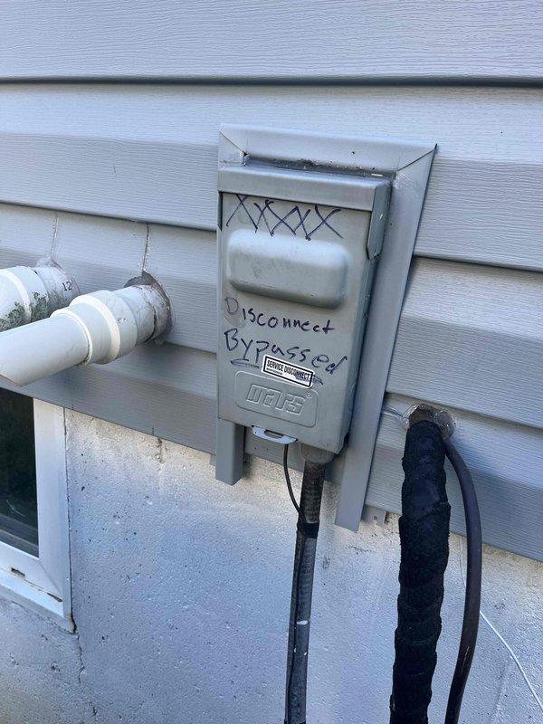 Responded to no cooling complaint affecting entire residence with 8-year-old condenser unit. Upon arrival, inspected exterior disconnect box and electrical components mounted on building exterior. Identified issue with disconnect bypass configuration as noted on equipment labeling. Performed necessary repairs to restore proper system operation, resolving recurring cooling failure. Unit tested and confirmed operational upon completion of service call.