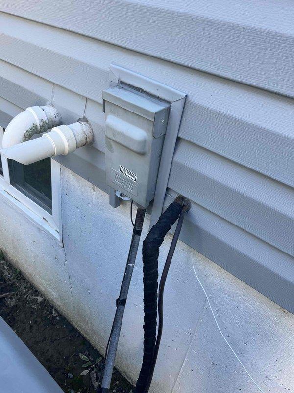 Responded to no cooling complaint affecting entire residence with 8-year-old condenser unit. Upon arrival, inspected exterior disconnect box and electrical components mounted on building exterior. Identified issue with disconnect bypass configuration as noted on equipment labeling. Performed necessary repairs to restore proper system operation, resolving recurring cooling failure. Unit tested and confirmed operational upon completion of service call.