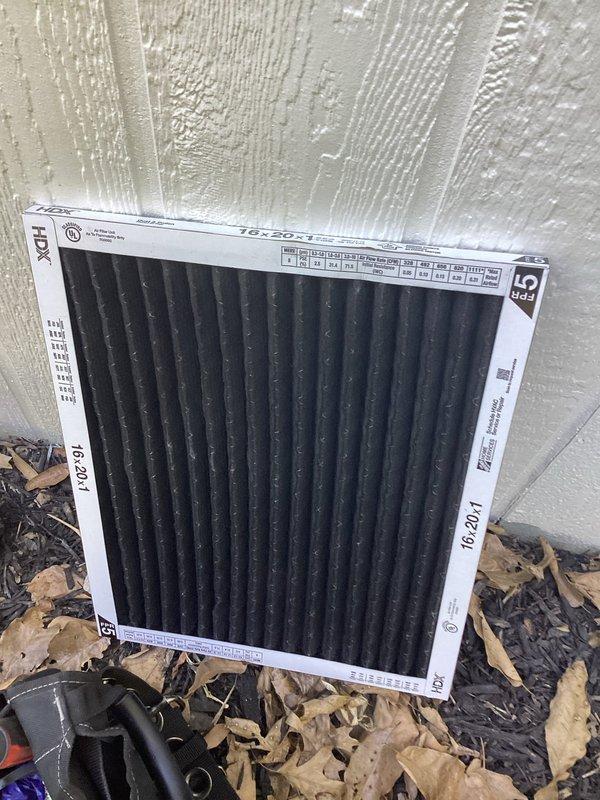 Responded to no cooling complaint on 10+ year old ground-level unit located at back of home. Upon arrival, performed diagnostic evaluation using refrigerant manifold and micron gauge to assess system pressures and operation. Inspected air filter and found restricted airflow condition. System pressures indicated 232.5 PSI high side and 21.8 PSI low side with ambient conditions present. Completed full system diagnostics and documented equipment conditions with photographic evidence for service records.