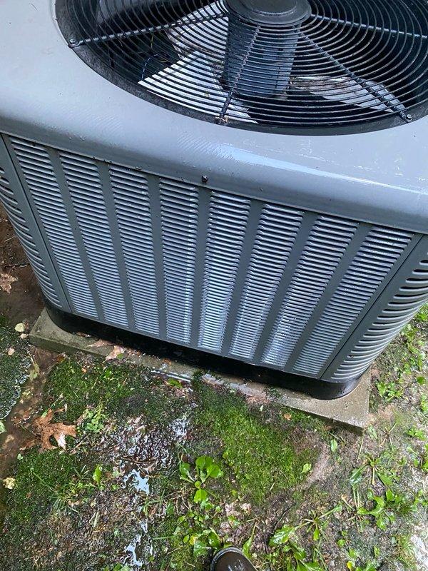 Completed seasonal tune-up maintenance on a 5-year-old outdoor heat pump unit located on side of house. Performed comprehensive system inspection including temperature differential measurements, verified proper fan operation through top grille assembly, and confirmed unit functionality. All components operating within normal parameters at time of service completion.