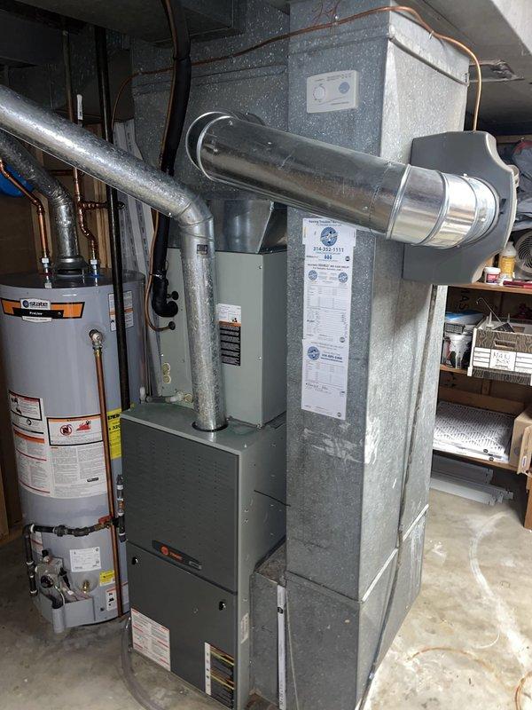 Responded to no cooling complaint on 18-year-old Trane system unable to maintain 72°F setpoint, remaining at 78°F. Upon arrival, located outdoor condensing unit and removed access panel for inspection. Performed visual and electrical diagnostics on condenser components including contactor, capacitor, and wiring connections. Found failed dual run capacitor with visible signs of age-related deterioration and corrosion on internal components. Replaced defective capacitor with proper MFD-rated unit, verified all electrical connections secure, and tested contactor operation. Restored power to system and monitored startup sequence. Confirmed compressor and condenser fan motor energized properly with normal amperage draw. Verified refrigerant pressures within manufacturer specifications and system achieving proper temperature split across evaporator coil in basement air handler. System cycled normally and began pulling down indoor temperature effectively. Reinstalled condenser access panel an