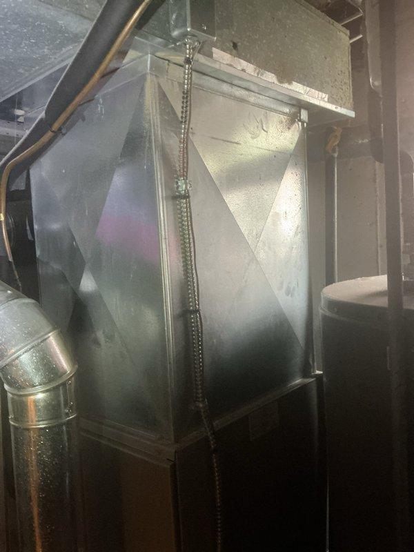 Responded to service call for 9-year-old residential air conditioning system experiencing recurring grinding noise every 45 seconds from both the basement unit and outdoor condenser. Upon arrival after scheduled timeframe, performed diagnostic inspection of both indoor and outdoor equipment. Examined outdoor condenser unit including compressor, motor assembly, and associated refrigerant lines and electrical connections. Inspected indoor air handler and ductwork system in basement for mechanical issues. Identified source of grinding noise, documented equipment condition through photography, and completed necessary repairs to restore normal system operation.