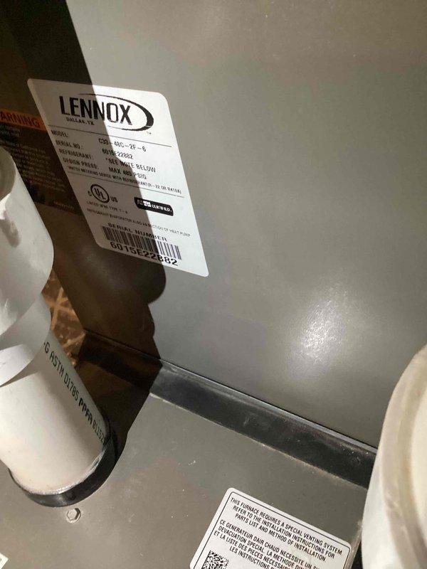 Responded to no cooling complaint on 10+ year old Lennox unit located in backyard. Upon arrival, confirmed clogged condensate drain line preventing proper system operation. Cleared drain line obstruction, verified proper drainage flow, and tested system operation. Unit cooling properly at departure with thermostat displaying appropriate temperature differential.