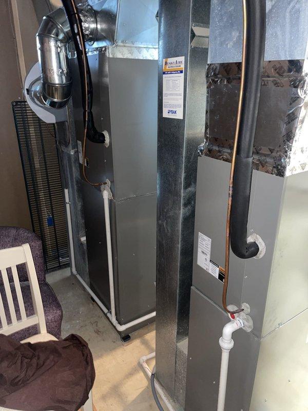 Responded to no cooling call for dual HVAC system with both units under two years old. Upon arrival, verified thermostat was set to cooling mode and calling for 76°F. Inspected basement-located air handler and associated ductwork, checking electrical connections, refrigerant lines, and condensate drainage system. Diagnosed issue and restored cooling operation to both Lennox units, ensuring proper airflow and system function throughout the home.