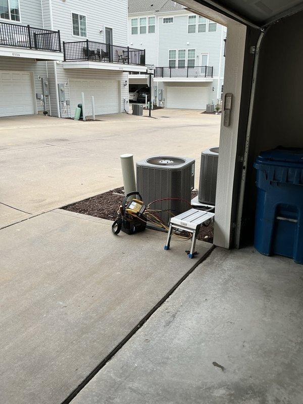 Responded to no cooling complaint on residential air conditioning system. Upon arrival, found unit had been shut off. Performed diagnostic evaluation of outdoor condensing unit and indoor air handler system. Inspected electrical connections, refrigerant lines, and control components. Observed water staining on utility room floor near furnace and air handler, indicating potential condensate drainage issue requiring attention. Documented equipment conditions and system layout with photographs for service records.