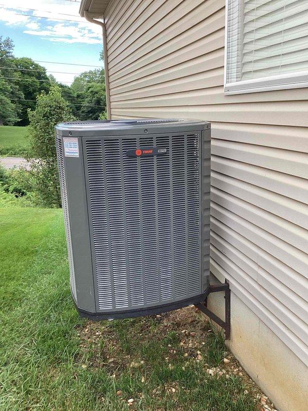 Responded to no cooling call on Trane outdoor unit (U10) located at side of home. Upon arrival, found system had been shut off and thermostat displaying 80°F with system in off mode. Called ahead as requested, performed diagnostic evaluation of outdoor condensing unit and verified proper placement on mounting bracket. Documented equipment condition with photos showing unit exterior and thermostat display reading indoor temperature of 80°F with 47% humidity and outdoor temperature at 77°F.