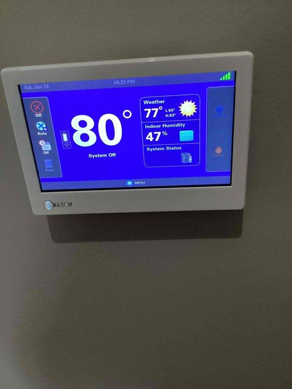 Responded to no cooling call on Trane outdoor unit (U10) located at side of home. Upon arrival, found system had been shut off and thermostat displaying 80°F with system in off mode. Called ahead as requested, performed diagnostic evaluation of outdoor condensing unit and verified proper placement on mounting bracket. Documented equipment condition with photos showing unit exterior and thermostat display reading indoor temperature of 80°F with 47% humidity and outdoor temperature at 77°F.
