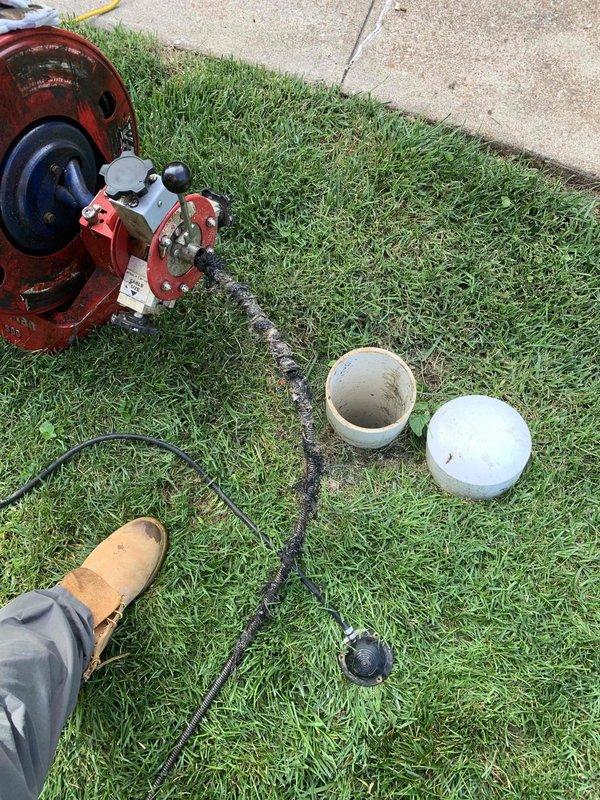 Responded to a kitchen drain stoppage that extended from the kitchen drain line into the main sewer line. Accessed the sewer line through the exterior cleanout and performed hydro-jetting to clear the blockage. Removed roots and debris obstructing the line, restoring proper drainage flow. Tested the system to confirm full functionality and proper discharge.
