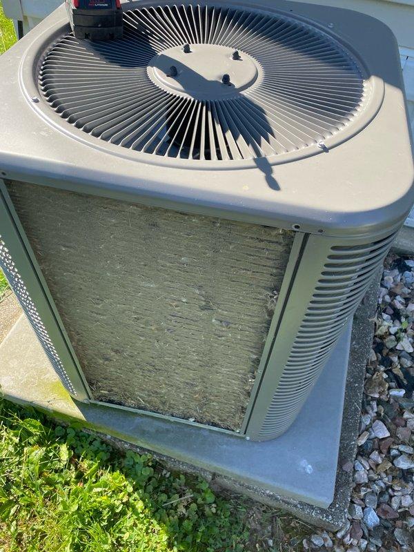 Completed preventive maintenance tune-up on a ten-year-old residential air conditioning system. Performed comprehensive inspection of outdoor condenser unit, which showed significant accumulation of dirt and debris on coil surfaces. Cleaned condenser coils, checked fan operation, verified proper airflow through grilles, and ensured unit was operating within normal parameters.