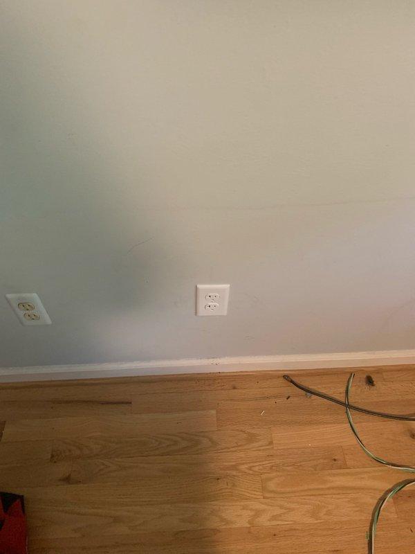 Installed dedicated electrical circuit with new wiring run from main panel to interior room location. Mounted exterior conduit with proper junction boxes and securing clamps on building exterior, then installed interior outlets with appropriate cover plates to provide power for specified equipment.