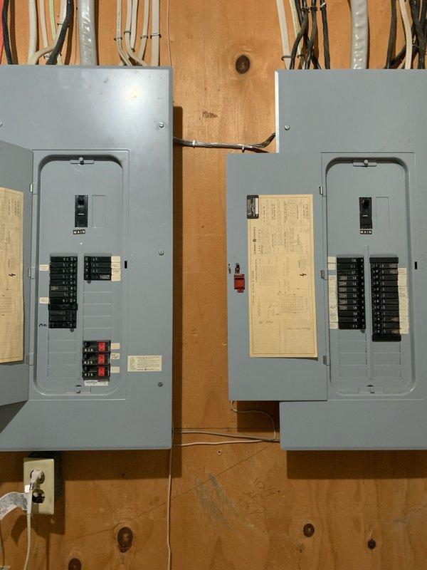 Completed electrical estimate for car charging station installation in unfinished basement area. Assessed existing electrical infrastructure including two main circuit breaker panels mounted on exposed studs to determine capacity and compatibility for EV charger integration. Evaluated available circuit breaker slots, main service amperage, and load calculations to ensure adequate power supply for Level 2 charging equipment. Documented current electrical panel configuration, wire routing paths along ceiling joists and walls, and optimal conduit runs from panels to proposed charging station location. Photographed existing electrical setup and basement layout for detailed estimate preparation.