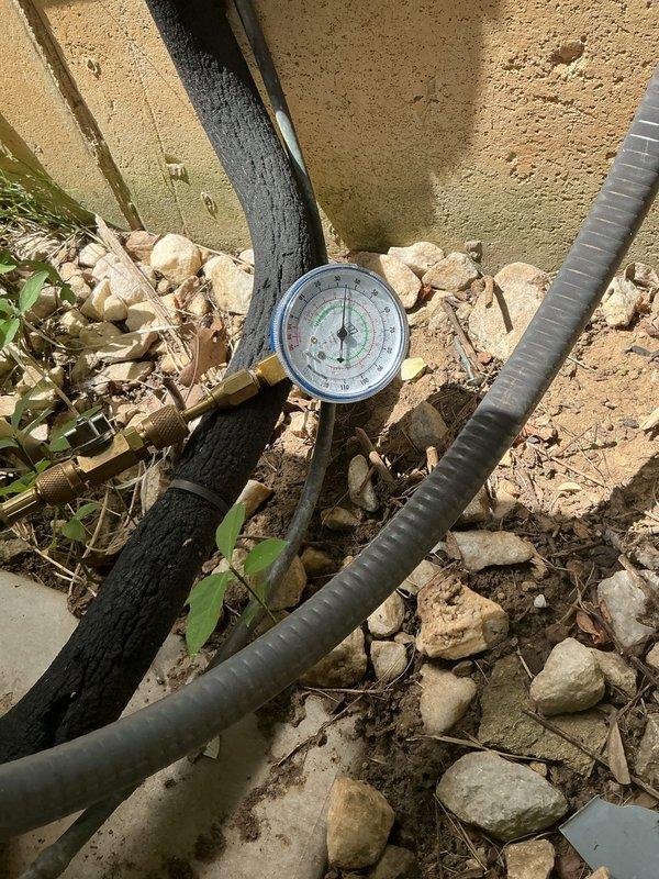 Responded to no cooling call on 20+ year old Lennox whole-house air conditioning system. Upon arrival, performed diagnostic assessment of outdoor condensing unit. Utilized manifold gauges to check refrigerant pressures and system operation. Documented equipment condition and test results with photos for service records. Completed troubleshooting procedures to identify root cause of cooling failure and provided recommendations for system repair or replacement given age of equipment.