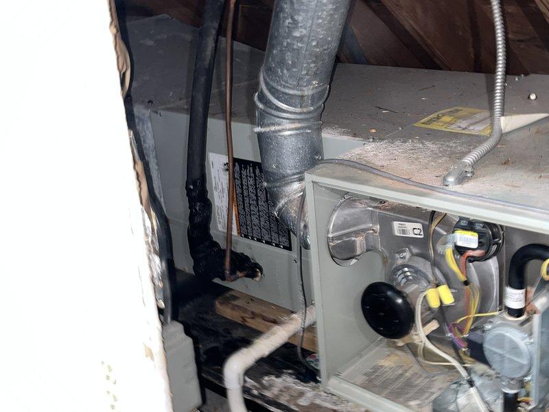 Responded to no cooling complaint on approximately 10-year-old residential air conditioning system. Upon arrival, accessed horizontal air handler unit located in attic space and performed diagnostic evaluation. Removed access panel to inspect internal components including blower motor, electrical connections, control boards, and refrigerant lines. Identified system malfunction preventing proper cooling operation. Completed necessary repairs to restore cooling functionality, verified proper airflow through ductwork, and confirmed all electrical connections were secure. Tested system operation to ensure unit was cooling effectively before departure.