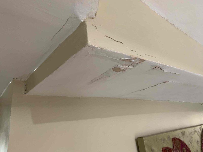 Responded to service call for clogged shower drain and toilet. Two-person crew accessed main stack via roof entry point using 10-foot ladder and performed cable clearing procedure through rooftop cleanout. Successfully cleared blockage in drainage system, restoring proper flow to both fixtures. Interior inspection revealed potential water damage on bathroom ceiling with visible staining and cracking, likely from previous plumbing issues or overflow events.