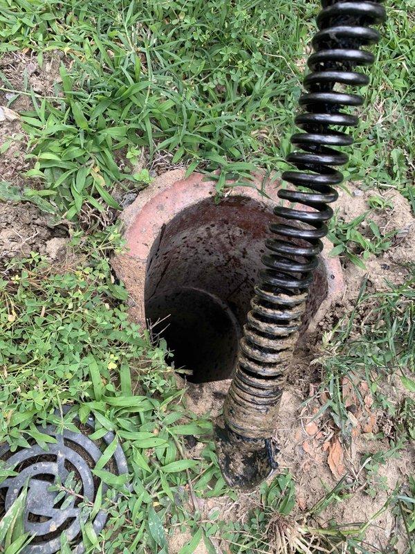 Responded to a basement drain backup with sewage overflow. Upon arrival, located the main sewer cleanout access point in the backyard and removed the cap to assess the blockage. Utilized a power auger with flexible cable to clear the obstruction in the main sewer line. Successfully restored proper drainage flow and verified system functionality. Replaced cleanout cap and secured all access points upon completion.