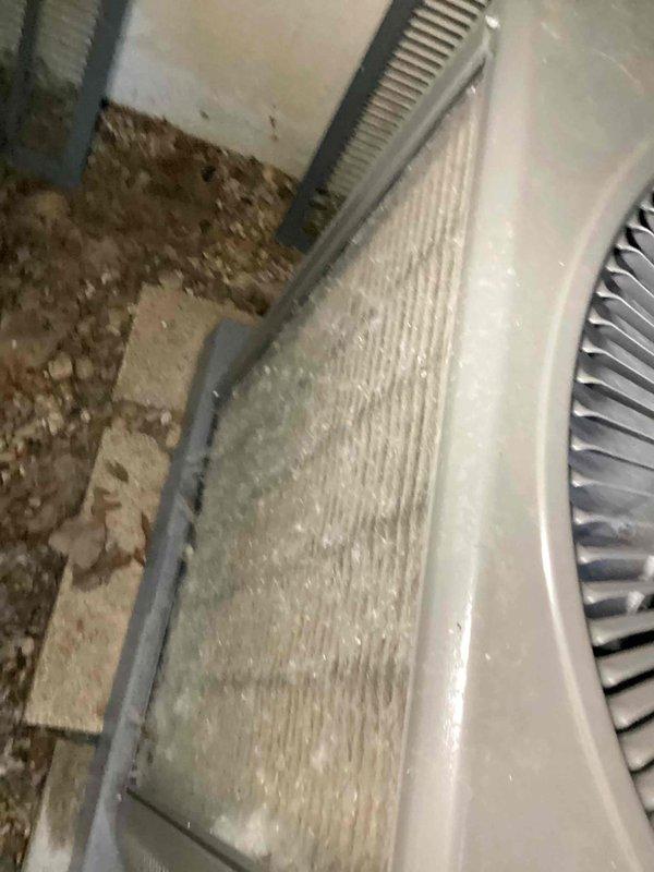 # HVAC Cooling System Tune-Up Completed

Performed comprehensive preventive maintenance inspection on residential air conditioning system. Unit was recently installed and requested for pre-summer season verification with no reported operational concerns.

## Work Performed

Conducted complete visual inspection of air handler and evaporator coil assembly located in basement utility area. Observed moderate accumulation of dust and debris on finned coil surfaces affecting airflow efficiency. Noted particulate matter and environmental debris present throughout coil sections and equipment housing.

Inspected condensate drain line and verified proper drainage function. Examined flexible ductwork connections for secure attachment and proper sealing. Assessed overall equipment installation and mounting integrity.

Evaluated electrical connections and control wiring for proper termination. Verified blower motor operation and airflow delivery. Checked refrigerant line insulation and connections 