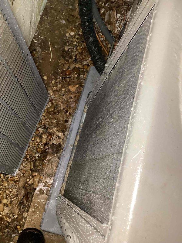 # HVAC Cooling System Tune-Up Completed

Performed comprehensive preventive maintenance inspection on residential air conditioning system. Unit was recently installed and requested for pre-summer season verification with no reported operational concerns.

## Work Performed

Conducted complete visual inspection of air handler and evaporator coil assembly located in basement utility area. Observed moderate accumulation of dust and debris on finned coil surfaces affecting airflow efficiency. Noted particulate matter and environmental debris present throughout coil sections and equipment housing.

Inspected condensate drain line and verified proper drainage function. Examined flexible ductwork connections for secure attachment and proper sealing. Assessed overall equipment installation and mounting integrity.

Evaluated electrical connections and control wiring for proper termination. Verified blower motor operation and airflow delivery. Checked refrigerant line insulation and connections 