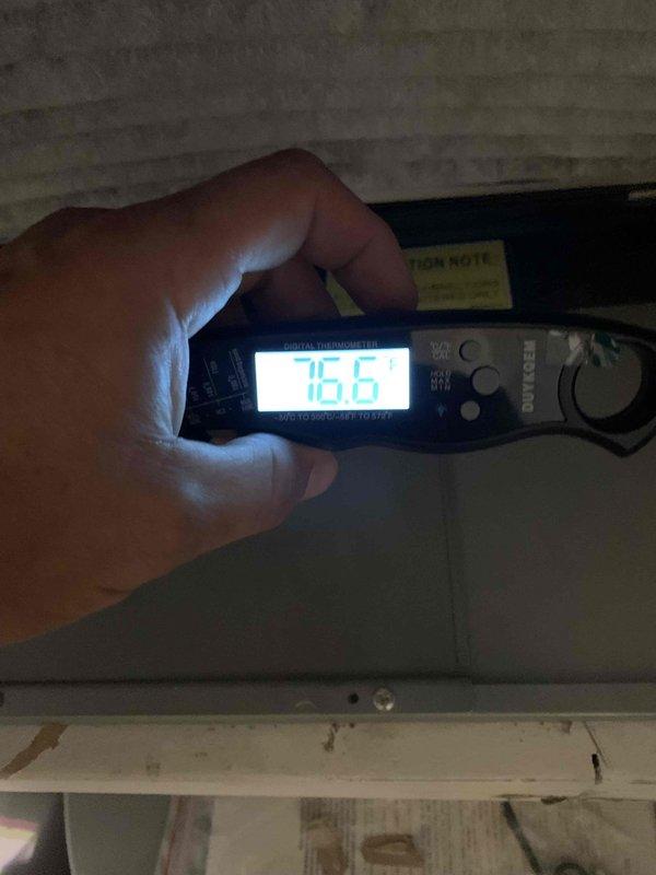 Performed complimentary second opinion evaluation on residential air conditioning system less than 10 years old following another contractor's diagnosis of refrigerant leak. Accessed attic-mounted air handler unit and conducted thorough inspection of evaporator coil assembly, refrigerant lines, and system components. Measured supply air temperature at 75.6°F and visually inspected evaporator coil condition through access panel, finding coils clean with proper fin alignment and no visible signs of refrigerant leakage, corrosion, or oil residue that would indicate leak points. Provided findings and recommendations to customer for informed decision-making regarding previously diagnosed issue.