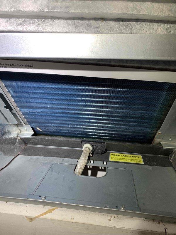 Performed complimentary second opinion evaluation on residential air conditioning system less than 10 years old following another contractor's diagnosis of refrigerant leak. Accessed attic-mounted air handler unit and conducted thorough inspection of evaporator coil assembly, refrigerant lines, and system components. Measured supply air temperature at 75.6°F and visually inspected evaporator coil condition through access panel, finding coils clean with proper fin alignment and no visible signs of refrigerant leakage, corrosion, or oil residue that would indicate leak points. Provided findings and recommendations to customer for informed decision-making regarding previously diagnosed issue.