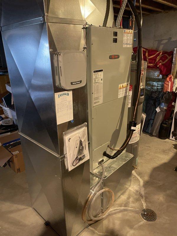 Completed installation of replacement evaporator coil and thermostatic expansion valve (TXV) on air handler unit serial number 19211ynh3v. Removed failed original components and installed new Trane evaporator coil assembly with integrated TXV, ensuring proper refrigerant line connections and condensate drainage. System tested and verified operational for cooling mode with proper airflow and temperature differential across the coil.