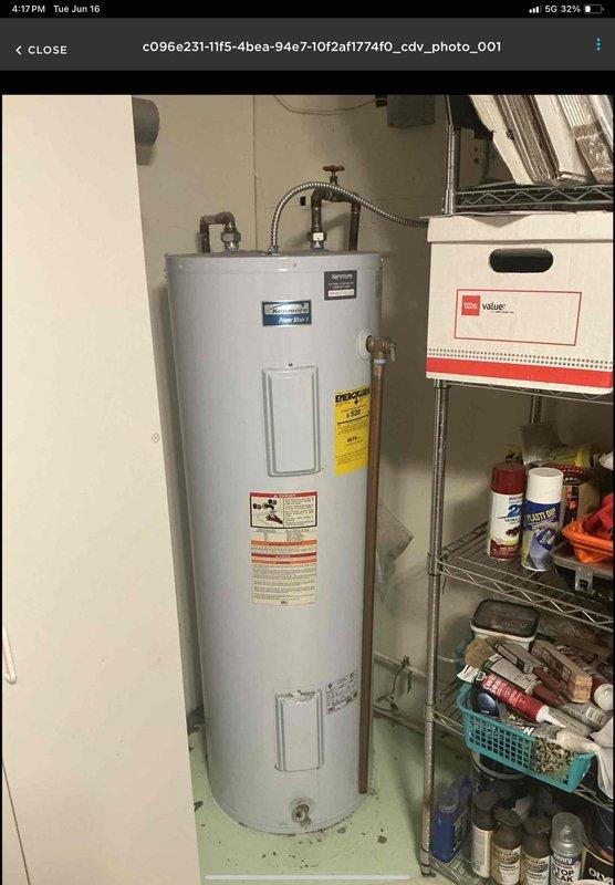 Completed installation of 50-gallon tall electric water heater in basement utility area. Unit was set up and prepared for delivery with all necessary plumbing connections, including copper piping, expansion tank, and flexible connectors properly installed per manufacturer specifications and local code requirements.