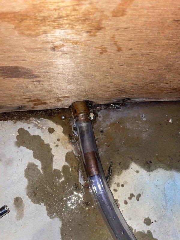 Responded to install callback for condensate line leak causing damage to tile flooring. Inspected condensate drain system and verified proper drainage from evaporator coil to floor drain. Corrected condensate line routing and secured all connections with appropriate clamps to prevent future leakage and floor damage.