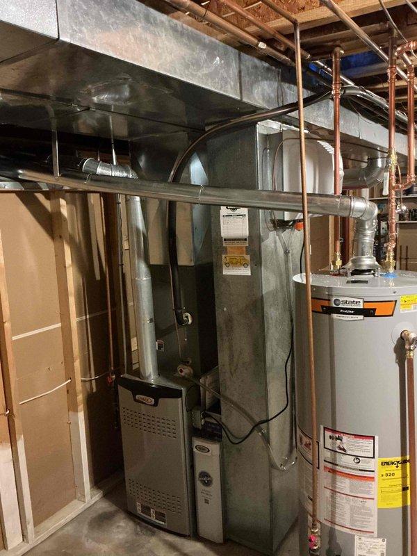 Installed a 50-gallon tall gas water heater in basement utility area, completing all copper piping connections to existing overhead plumbing system. Coordinated afternoon arrival for equipment pickup and verified City of Kirkwood permit requirements, which did not require plumbing ID sticker for this installation. All connections tested and system operational upon completion.