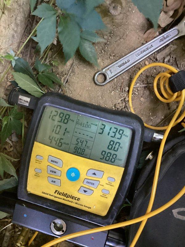 Responded to no cooling complaint on 2-year-old central air conditioning system. Upon arrival, confirmed system was running but not producing cold air to conditioned space. Performed diagnostic evaluation of outdoor condensing unit and indoor air handler components. Utilized refrigerant manifold gauges and micron measurement equipment to assess system pressures and refrigerant charge levels. Inspected blower motor assembly and ductwork connections at indoor unit for proper operation and airflow. Measurements indicated refrigerant system anomaly requiring pressure testing and charge verification. Documented equipment conditions and diagnostic readings for service records.