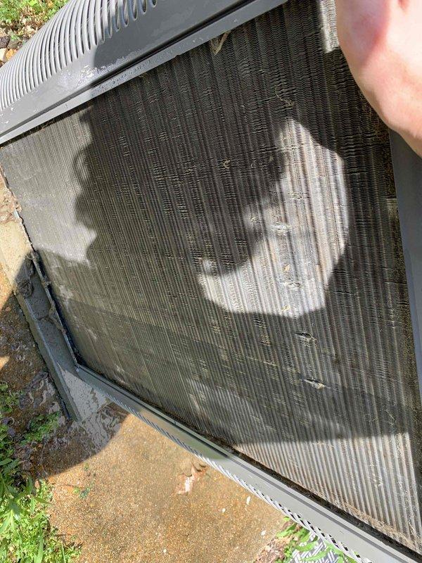 Completed cooling maintenance tune-up on a 9-year-old air conditioning system that was operating properly at time of service. Inspected and documented air filter showing moderate dust accumulation with light to moderate debris throughout pleated media, and exterior condenser coil exhibiting significant dirt and debris buildup restricting airflow, with concentrated patches of dust and environmental contaminants across the fin surfaces. Performed standard preventive maintenance procedures including system performance evaluation, component inspection, and cleaning as needed to restore optimal operating efficiency.