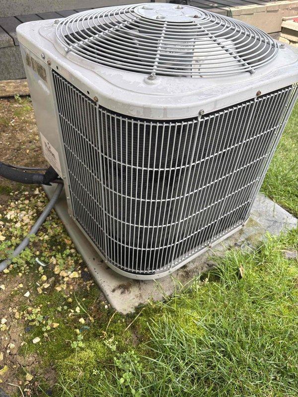 Completed preventive maintenance tune-up on a single outdoor air conditioning condenser unit located at ground level behind the residence. Performed comprehensive system inspection including electrical connections, control board functionality, capacitor testing, and refrigerant circuit evaluation. Verified proper operation of all safety controls and sequencing relays on the furnace control board, inspected all wiring harnesses for secure connections, and confirmed fan motor operation through the condenser's top-mounted assembly.
