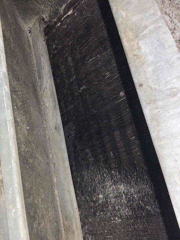 Completed comprehensive tune-up service on a 39-year-old ground-level air conditioning system. Inspected outdoor condenser unit and indoor evaporator coil, noting significant dust and debris accumulation on coil fins requiring attention. System operational upon completion with all components evaluated per standard maintenance protocol.