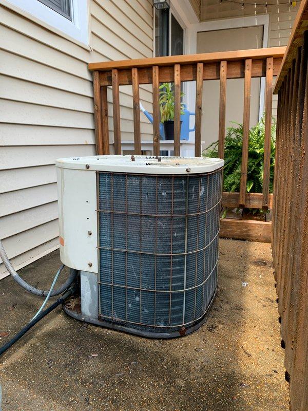 Completed comprehensive tune-up service on a 39-year-old ground-level air conditioning system. Inspected outdoor condenser unit and indoor evaporator coil, noting significant dust and debris accumulation on coil fins requiring attention. System operational upon completion with all components evaluated per standard maintenance protocol.