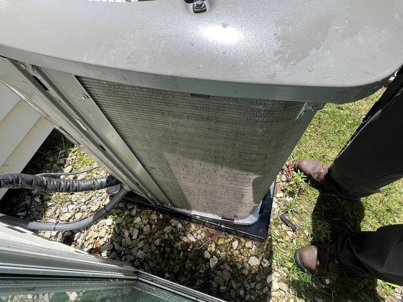 Completed annual maintenance on 2-year-old Lennox furnace and air conditioning system. Performed comprehensive tune-up including inspection of outdoor condenser unit, cleaned accumulated debris from coil fins, checked refrigerant levels, tested electrical connections, and verified system operation. Replaced air filter as requested and confirmed both heating and cooling systems are functioning within manufacturer specifications.