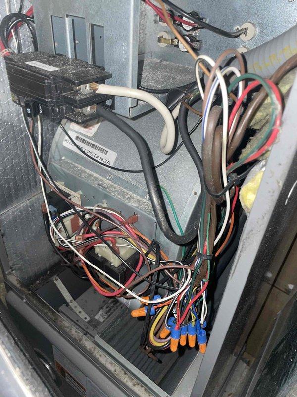 Completed preventive maintenance tune-up on residential HVAC system, including inspection of air handler electrical components, control board, transformer, and wiring connections. Verified proper operation of outdoor condensing unit and documented system condition with interior cabinet and exterior equipment photographs.