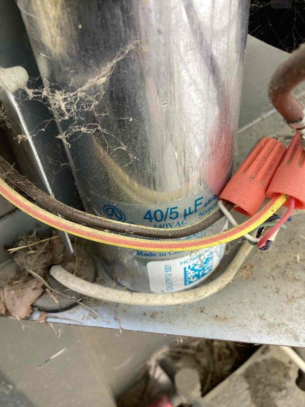 Completed cooling system tune-up on U10 air conditioning unit located at rear of property. Performed comprehensive maintenance including inspection of finned coil assembly, verified proper operation of 40/5 μF dual capacitor, cleaned accumulated debris from condenser coils, and confirmed all electrical connections were secure. Unit tested and operating within normal parameters upon completion.