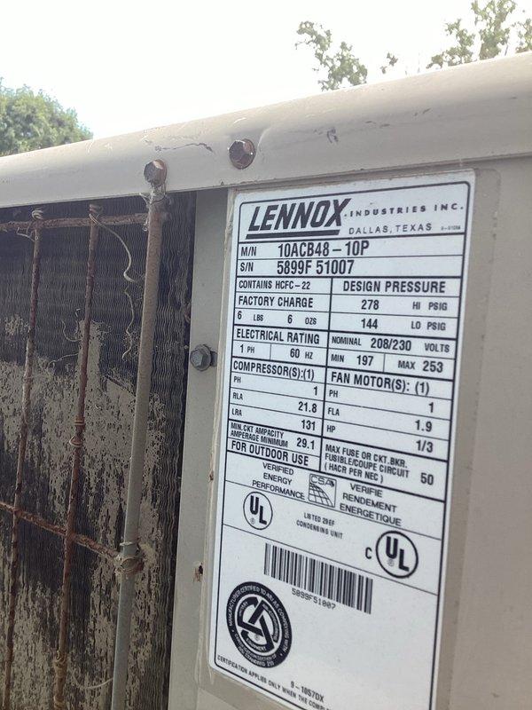 Responded to no cooling complaint on 10+ year old Lennox model 10ACB48-10P unit located at side of house. Performed diagnostic evaluation of system, inspected outdoor condensing unit and verified unit specifications. Documented equipment condition and captured unit nameplate data showing 208/230V electrical specifications and refrigerant pressures for service records.