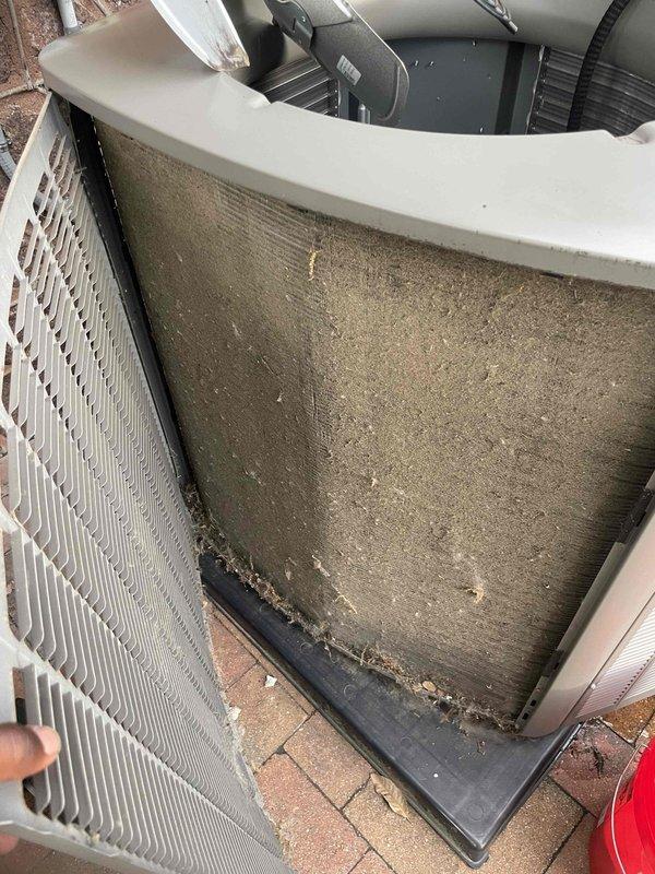 Responded to no cooling complaint on Unit 10 located at rear of property. Upon arrival, found outdoor condenser unit with heavily soiled coil panel and deteriorated base components with significant debris accumulation. Performed diagnostic evaluation of refrigerant system, accessing internal components and copper refrigerant lines for pressure and temperature analysis. Conducted hands-on inspection of heat exchanger coil, insulated refrigerant piping, and electrical connections to identify root cause of cooling failure. Work included proper handling of insulation materials during refrigerant line assessment and system component examination to restore cooling operation.