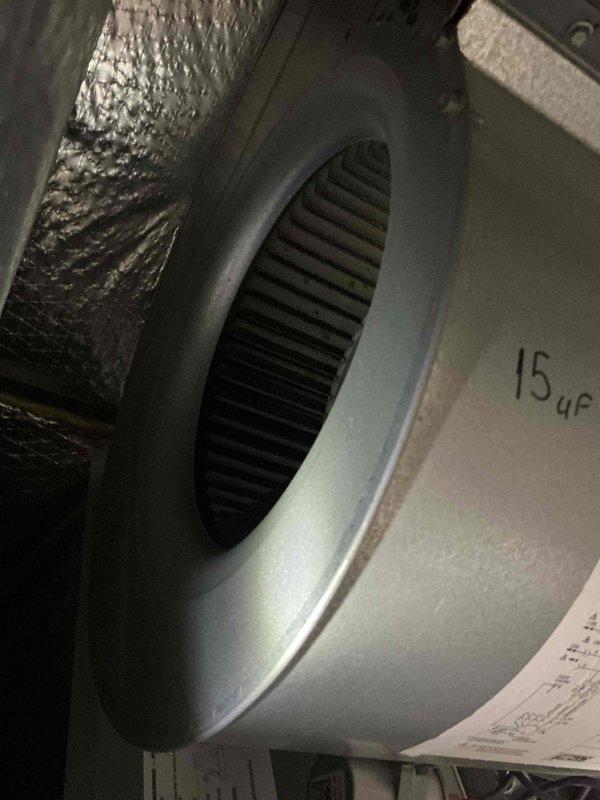 Completed comprehensive tune-up on a 12-year-old ground-level AC unit as part of Home Depot service agreement. Performed standard maintenance protocol including inspection of blower assembly with 15μF capacitor specification, verified proper operation of squirrel cage fan, examined outdoor condenser unit with intact protective grille and coil fins, and documented system condition through photographic records. All components found in functional condition with normal wear patterns appropriate for unit age.