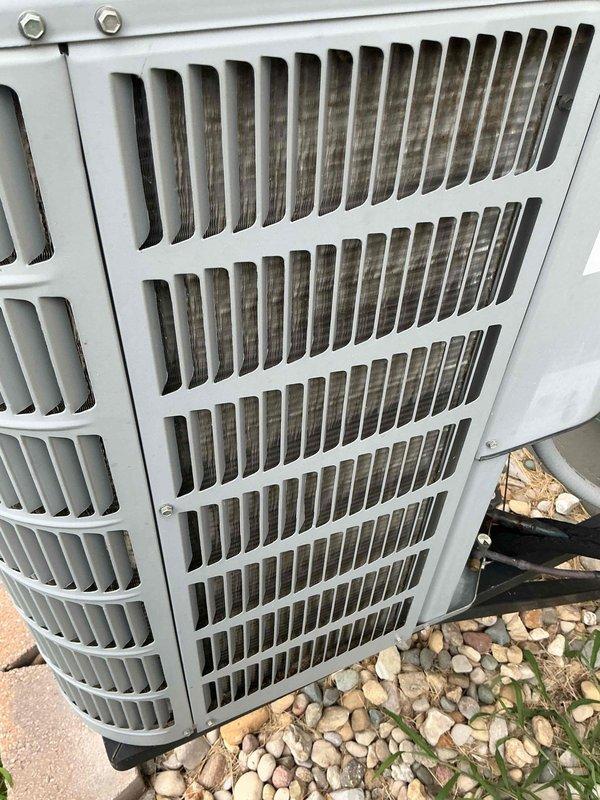 Completed comprehensive tune-up on a 12-year-old ground-level AC unit as part of Home Depot service agreement. Performed standard maintenance protocol including inspection of blower assembly with 15μF capacitor specification, verified proper operation of squirrel cage fan, examined outdoor condenser unit with intact protective grille and coil fins, and documented system condition through photographic records. All components found in functional condition with normal wear patterns appropriate for unit age.