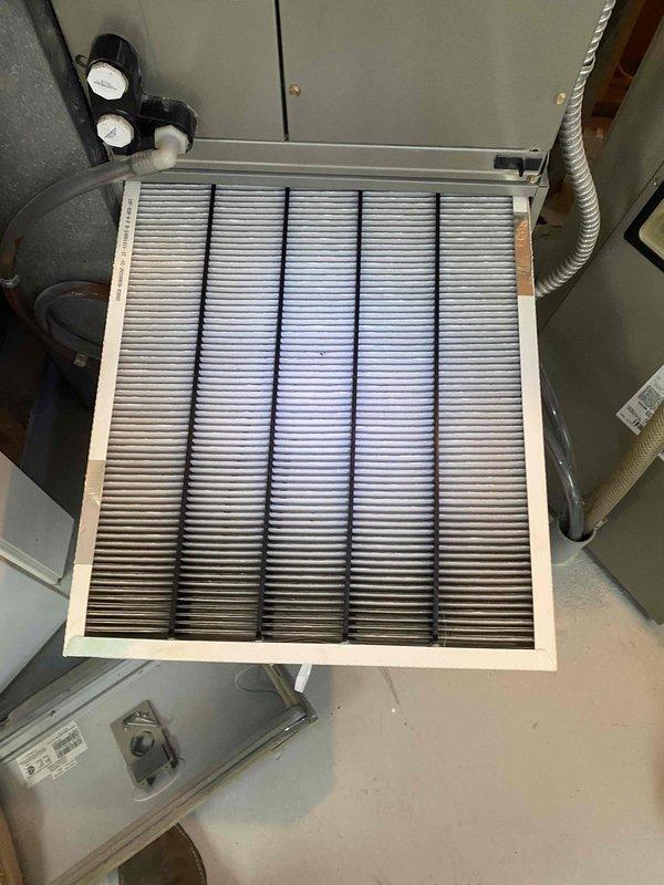 Completed annual cooling maintenance tune-up on residential HVAC system. Performed comprehensive inspection of indoor air handler unit including return air filter grille and outdoor condensing unit. Checked refrigerant pressures and levels, inspected all electrical connections, tested thermostat operation, and verified proper system functionality. System found operating within normal parameters with no refrigerant loss detected. All components cleaned and serviced per manufacturer specifications.