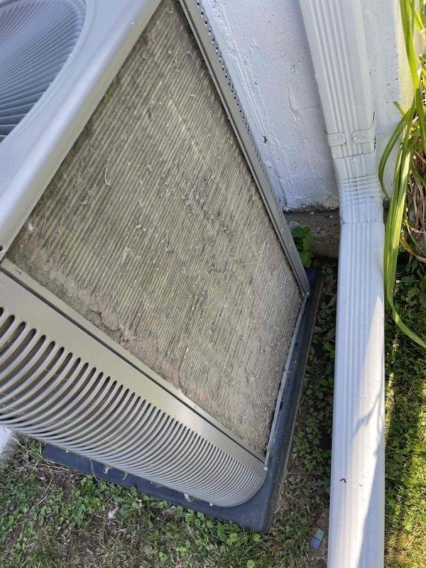 Completed comprehensive cooling system tune-up on single AC unit located in side yard. Performed standard maintenance procedures including inspection of internal components, filter assessment, and system evaluation. Unit showed significant filter contamination with heavy dust and debris accumulation requiring attention, and exterior housing displayed normal weathering consistent with outdoor exposure.